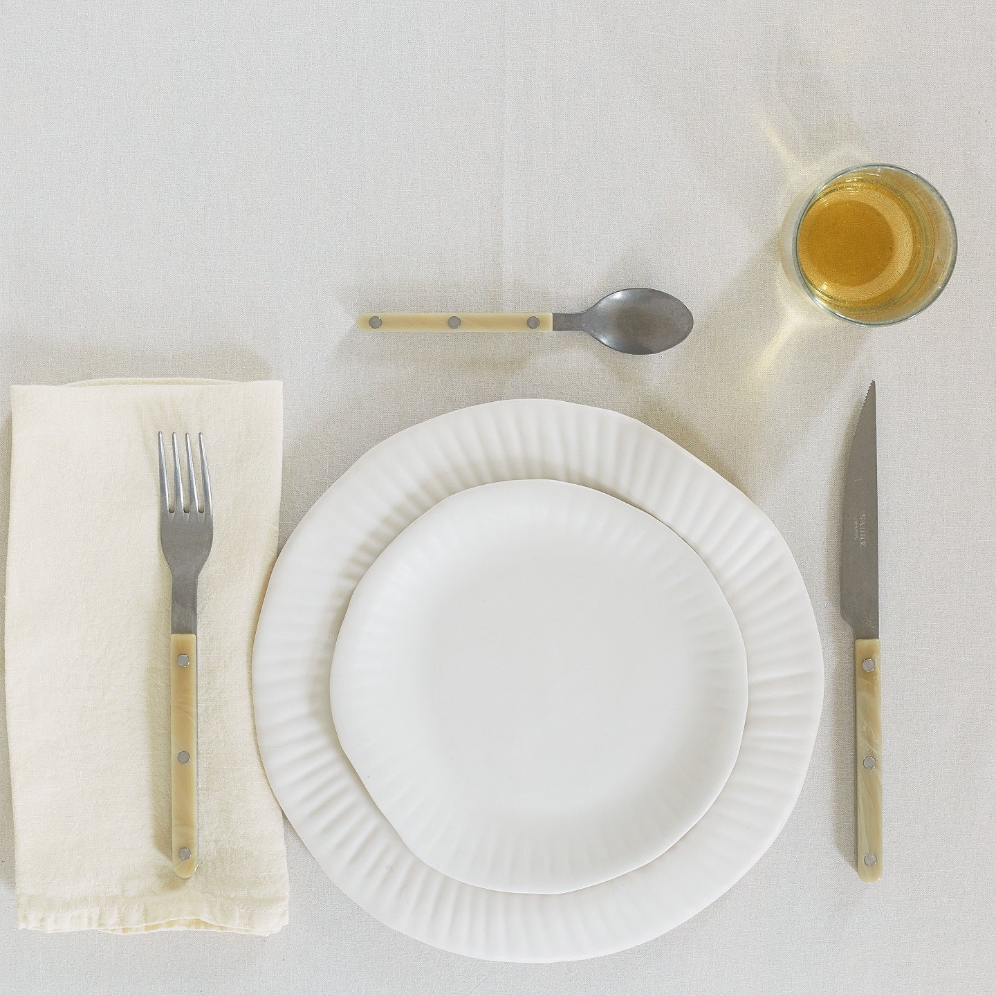 Placesetting with Simple Linen Napkin in Ivory.