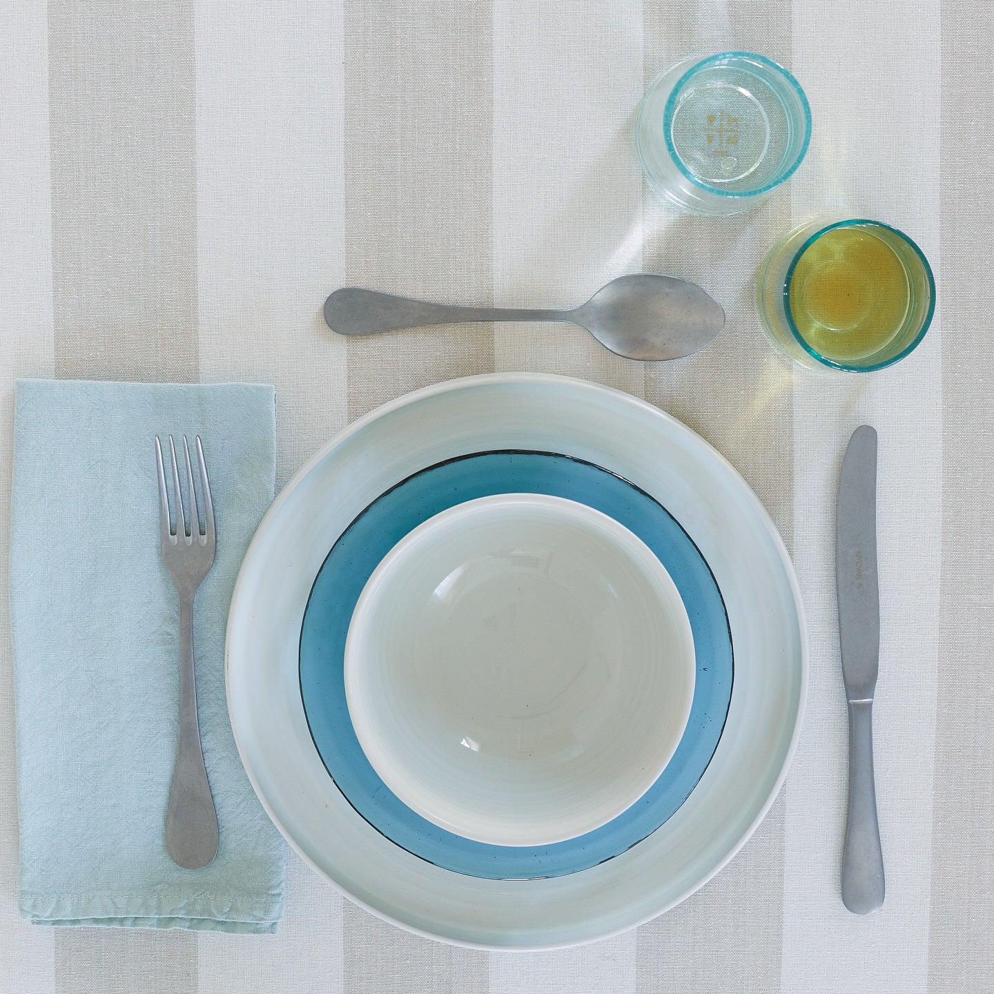 Placesetting with Simple Linen Napkin in Sky.