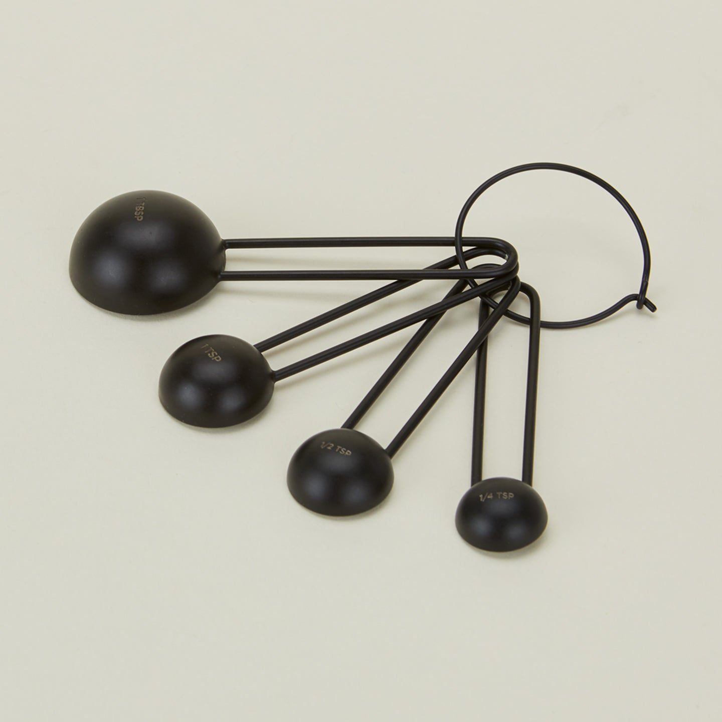 Detailed view of simple measuring spoons in black