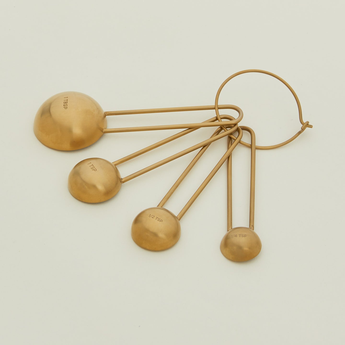 Detailed view of simple measuring spoons in brass