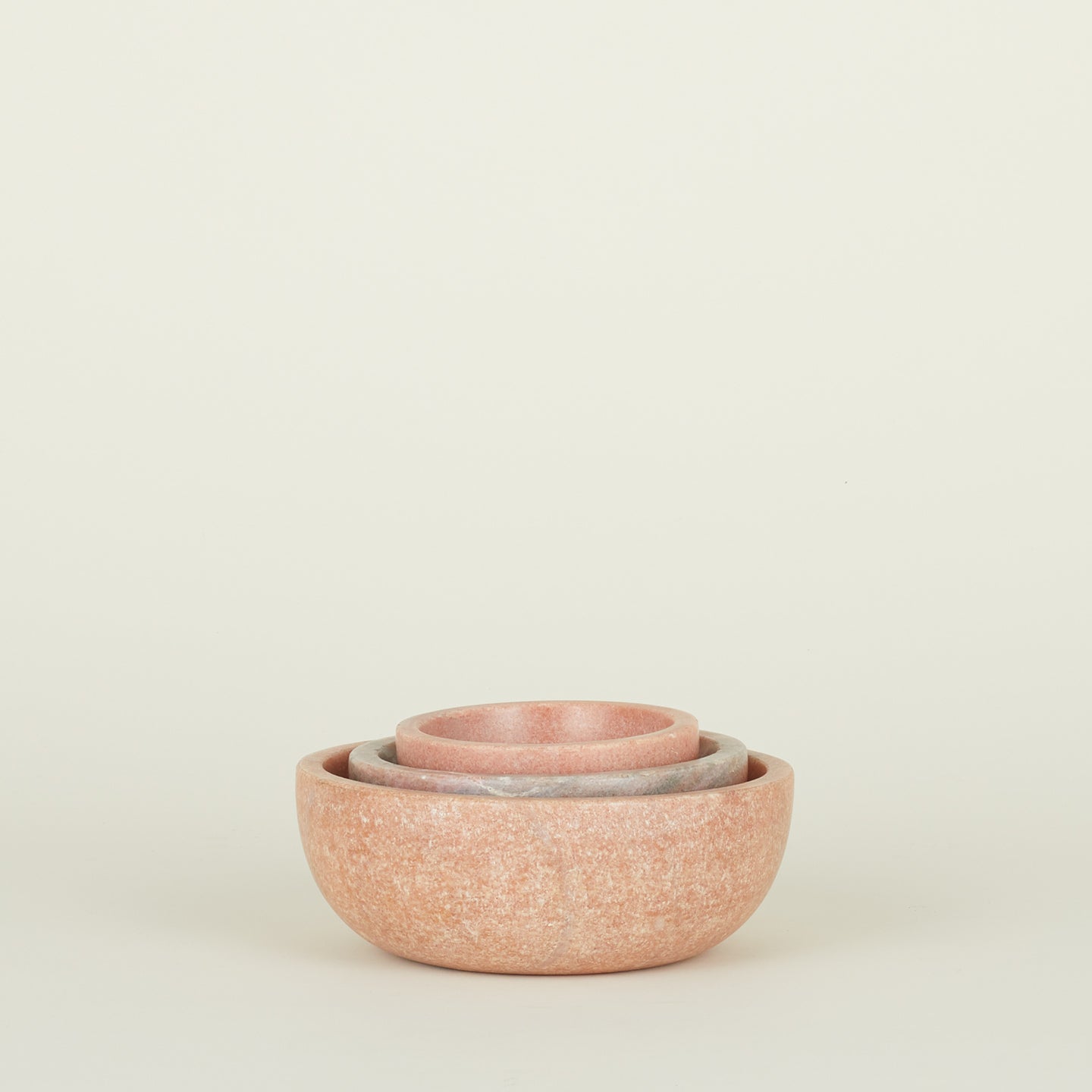 Three Simple Marble Bowls in various sizes in Pink, nested.