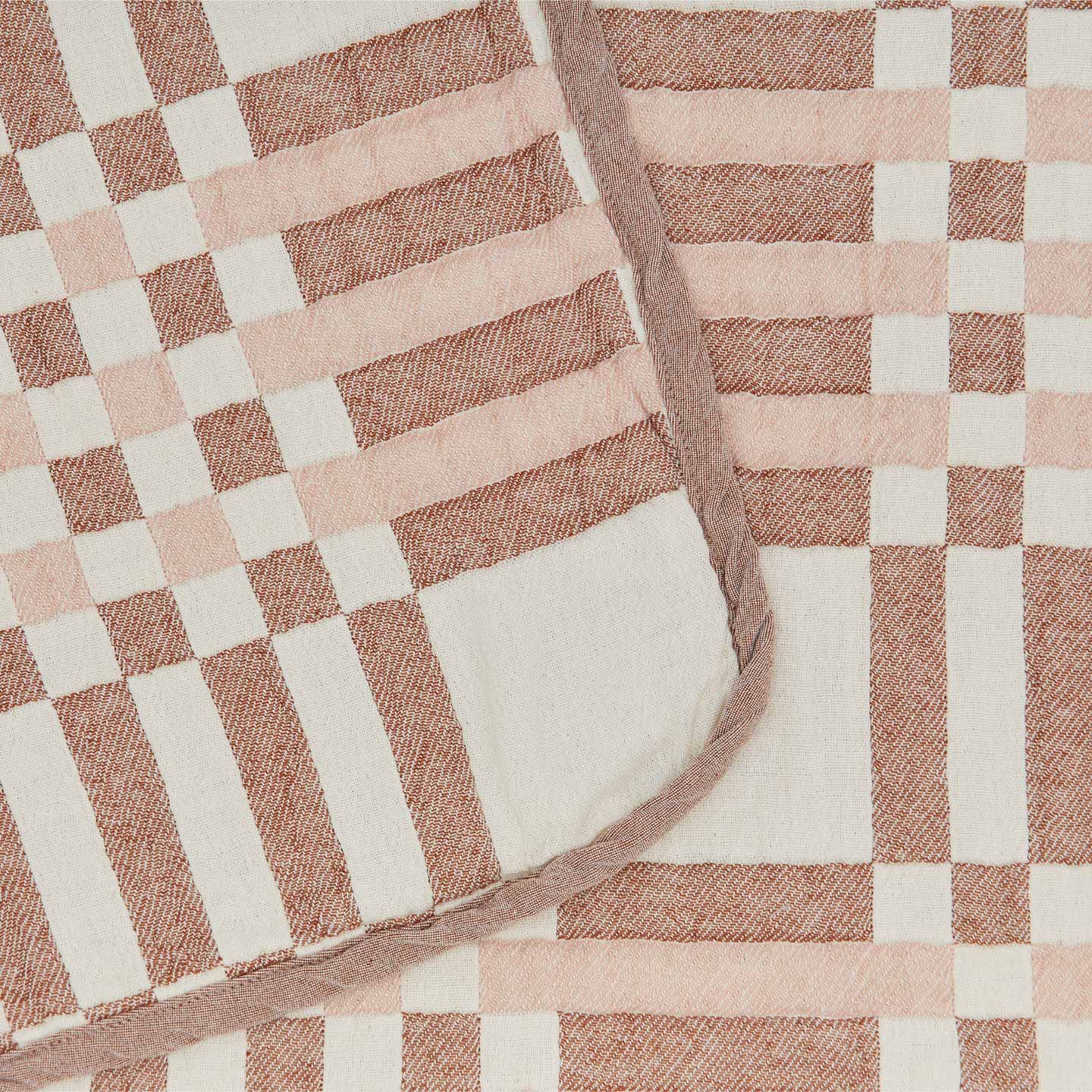 Close up of pattern on Simple Plaid Blanket in Blush and Terracotta.