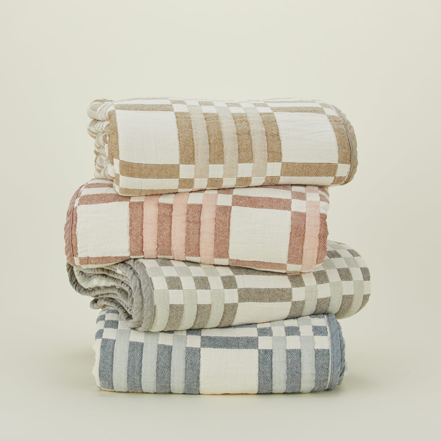 Stack of Simple Plaid Blankets in various colors.