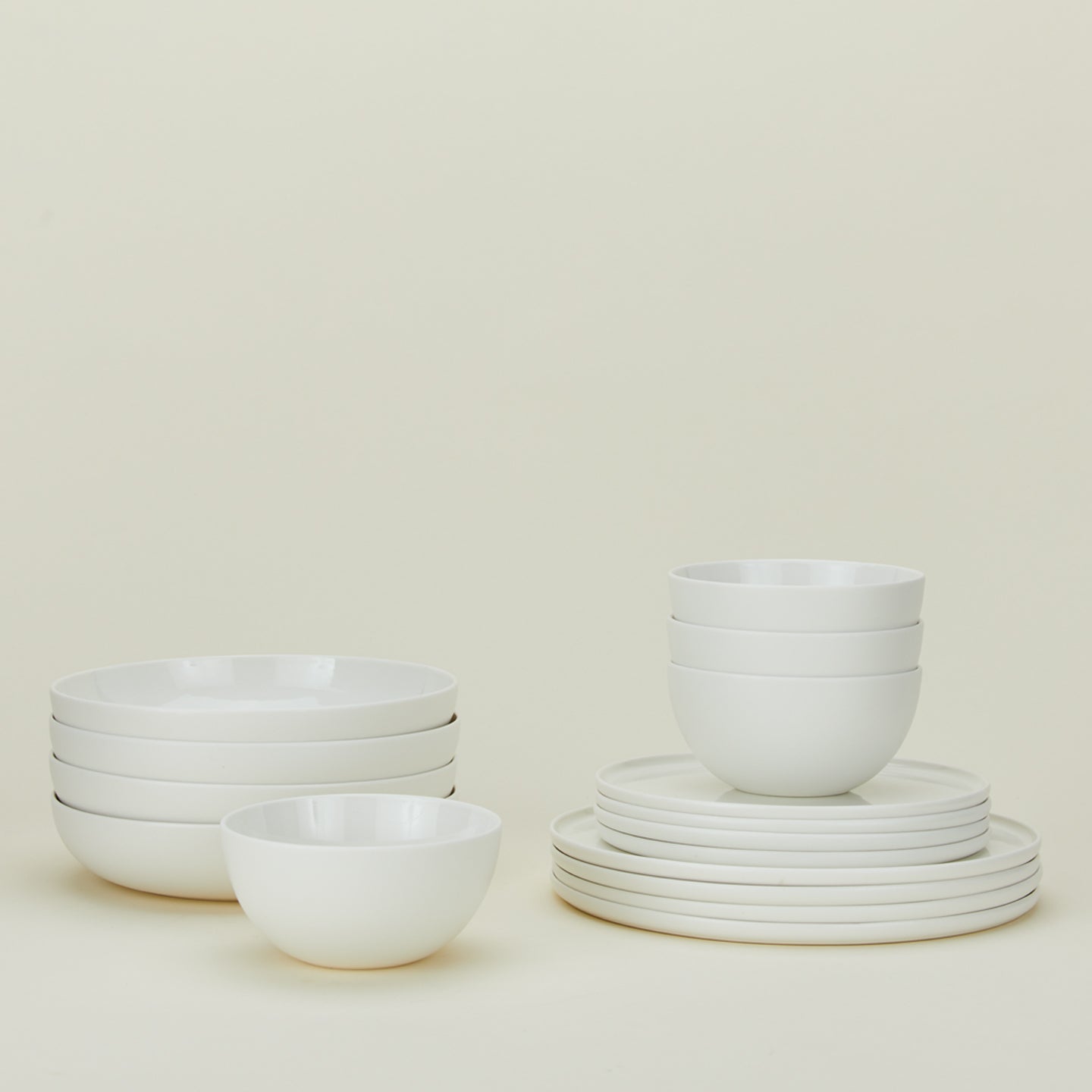 Simple Porcelain Dinnerware 16-Piece Set with low bowl, large bowl, salad plate, and dinner plate all in sets of 4 in white