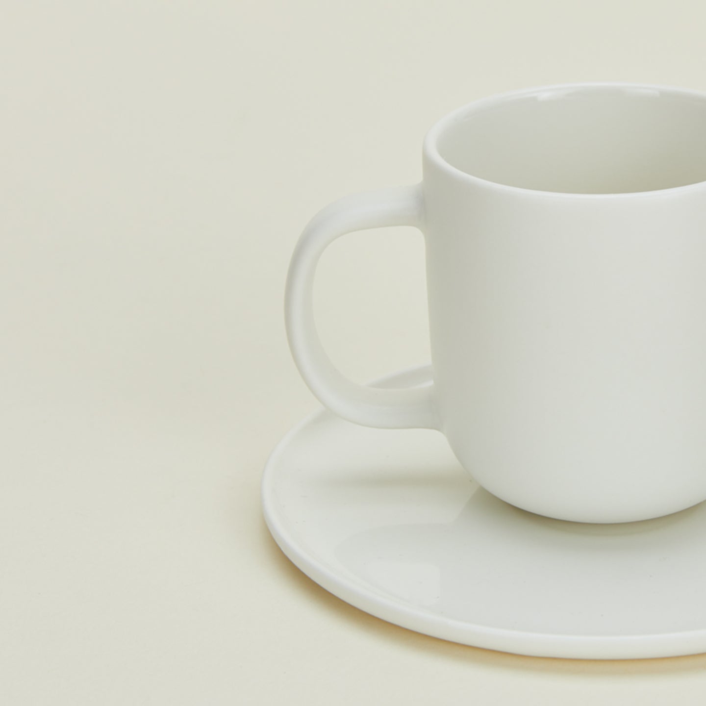 Close up view of simple porcelain espresso mug in white