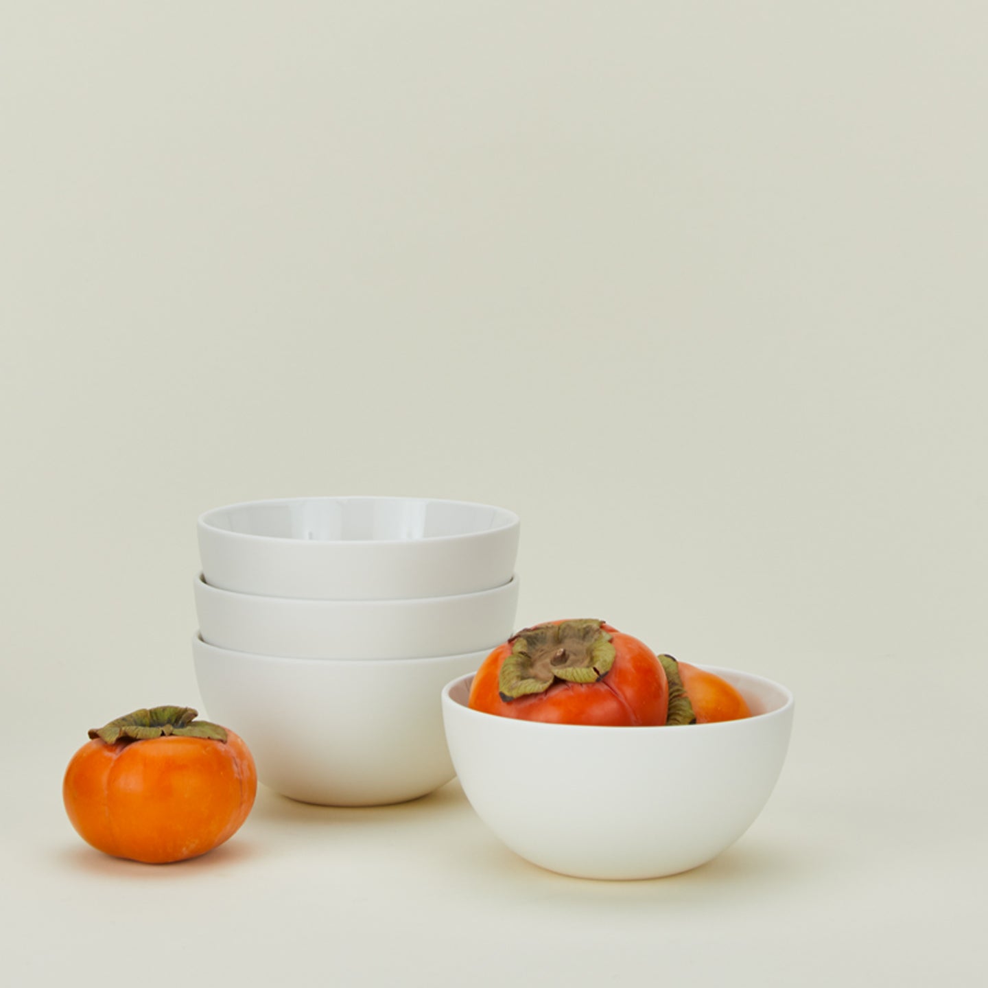 Simple porcelain large bowls in white with tomatoes