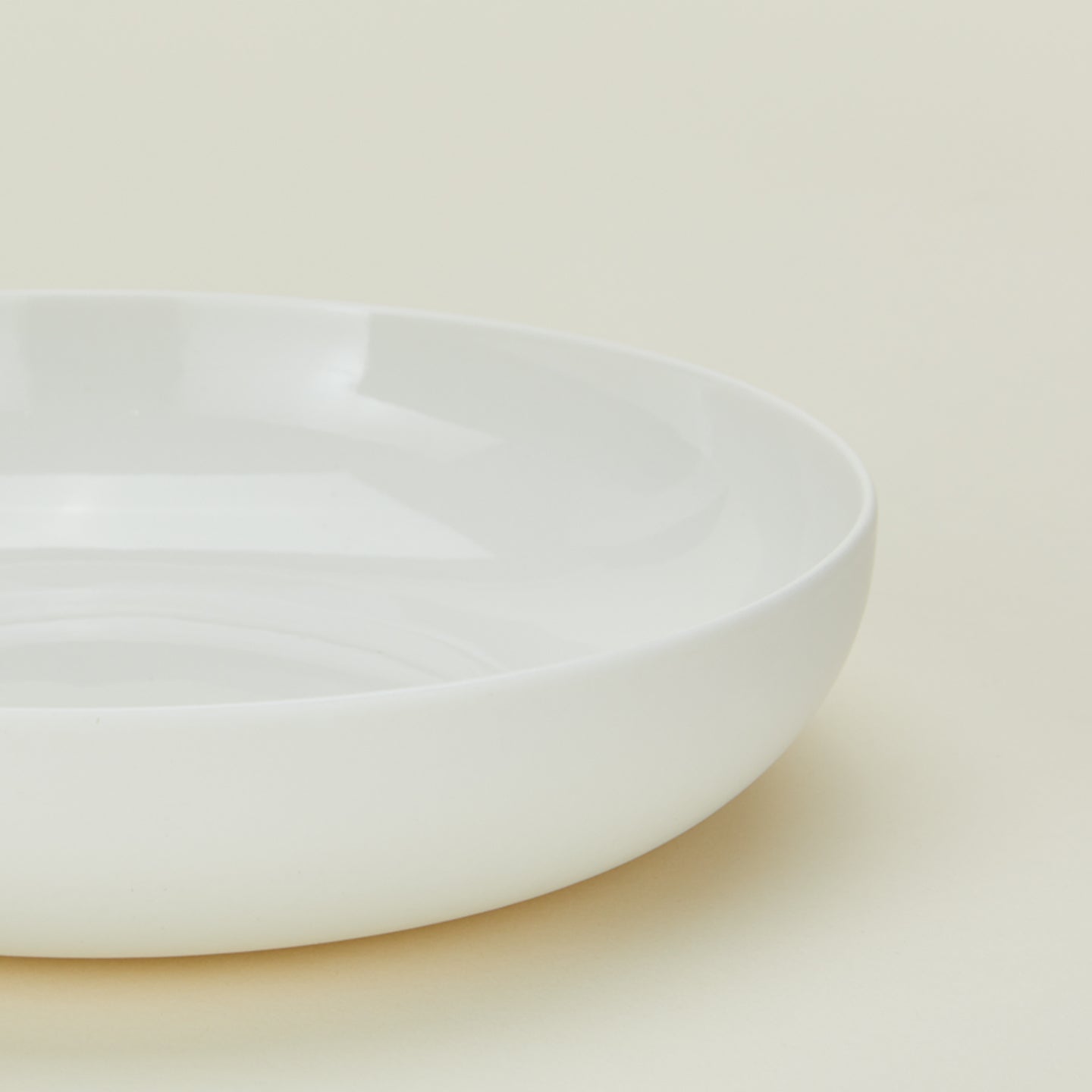 Close up view of simple porcelain low bowl in white