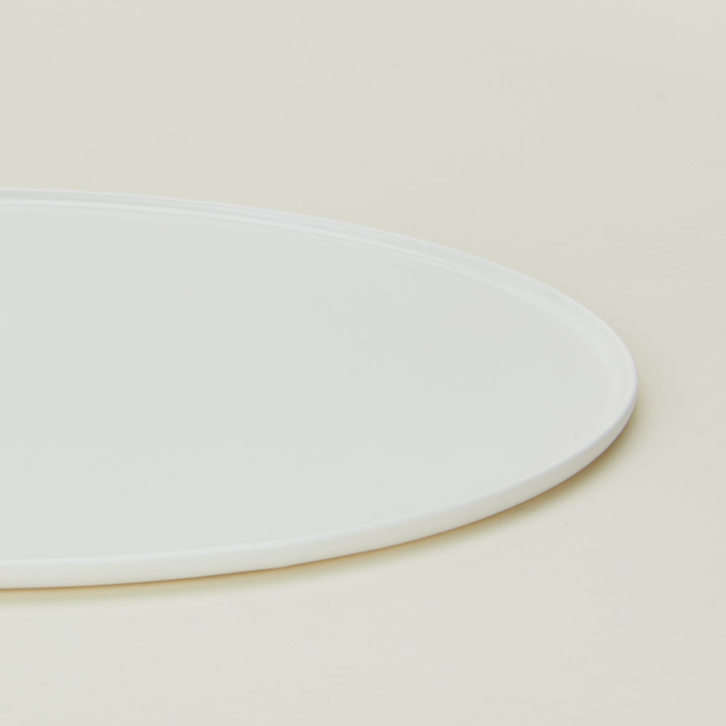 Close up view of simple porcelain serving platter in white