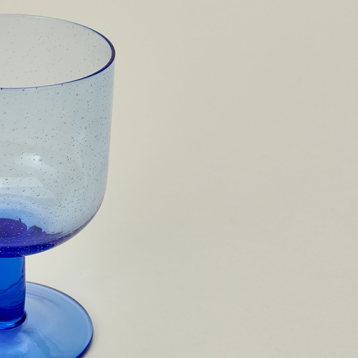 Detailed view of Simple seeded glassware in blue.