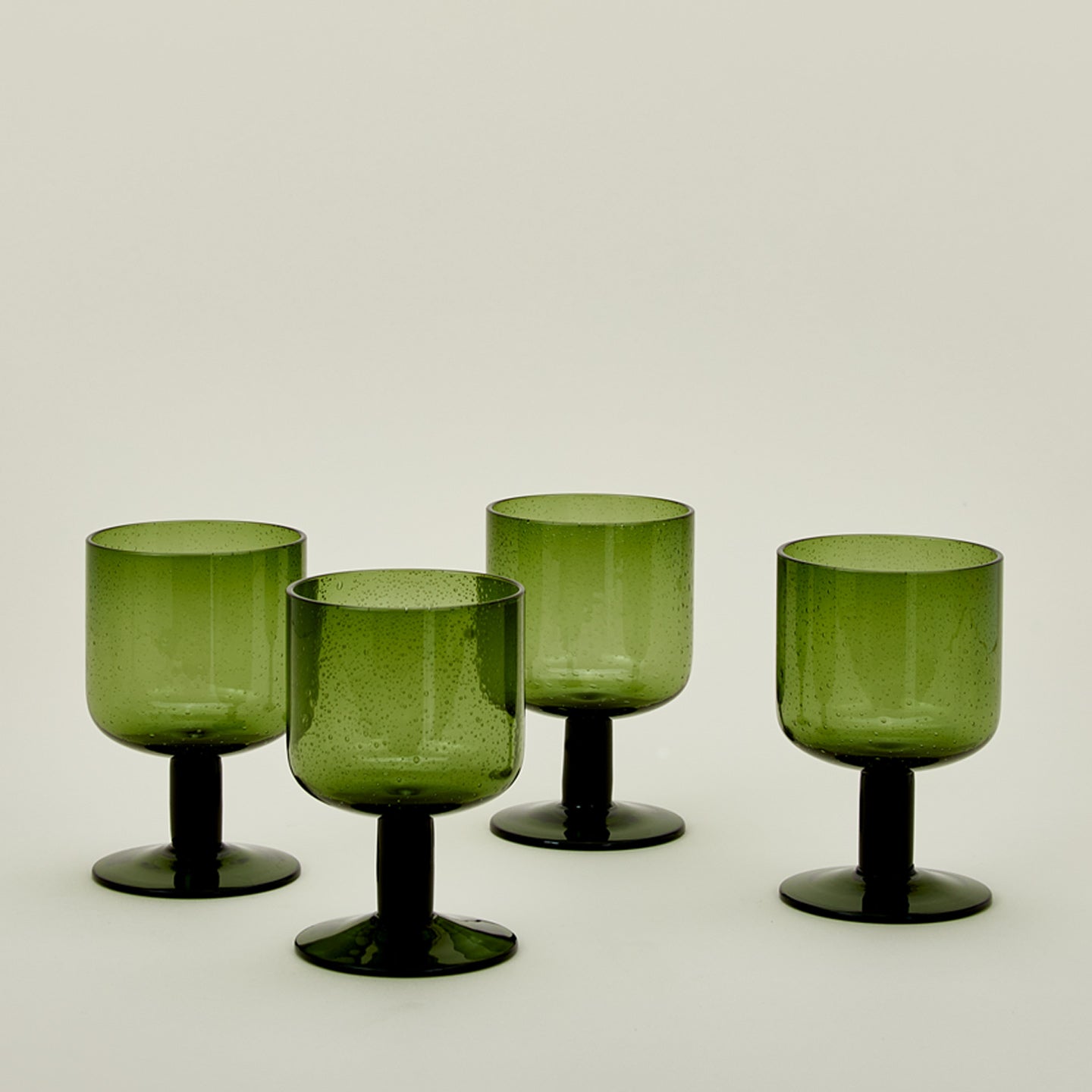 Simple seeded glassware in olive