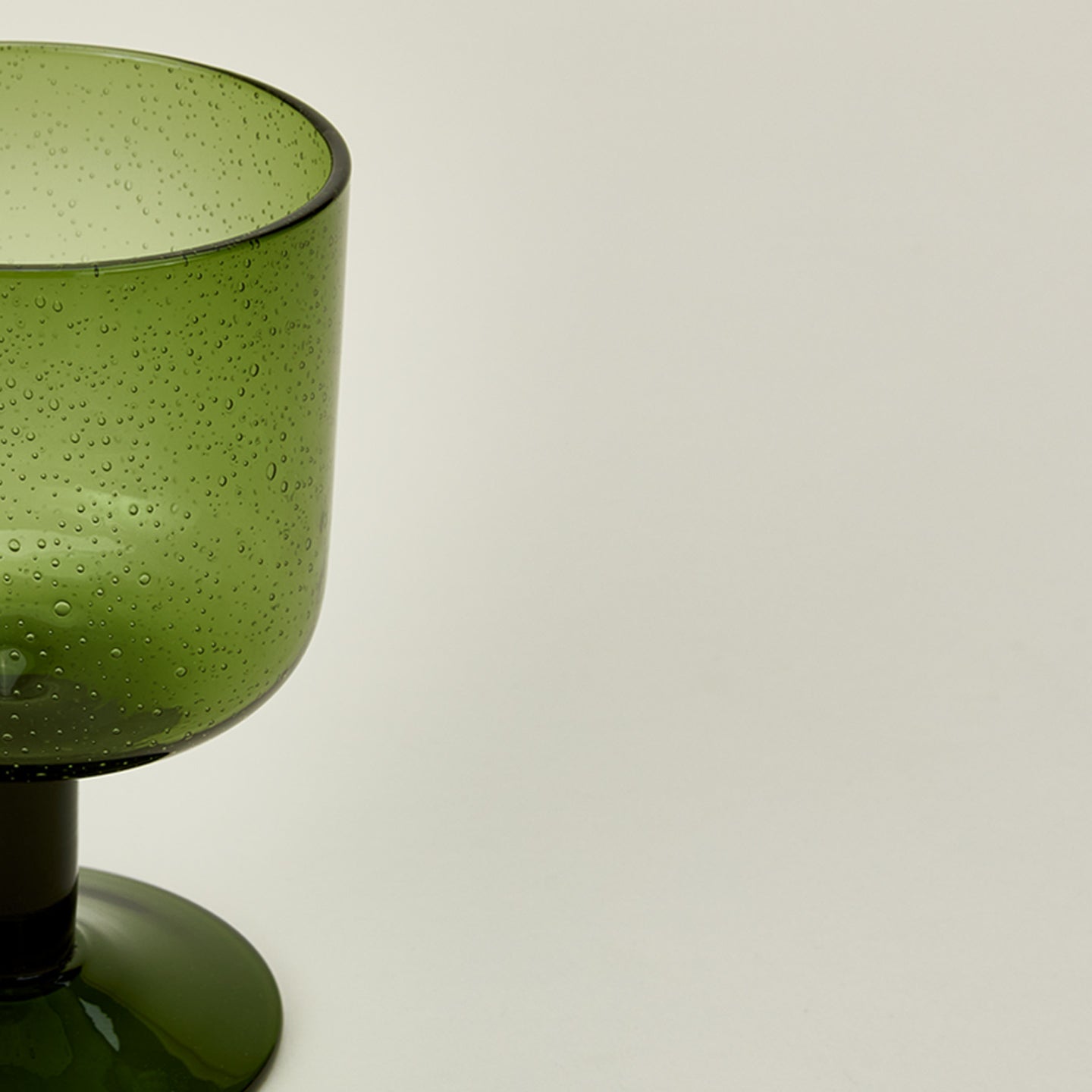 Detailed view of Simple seeded glassware in olive