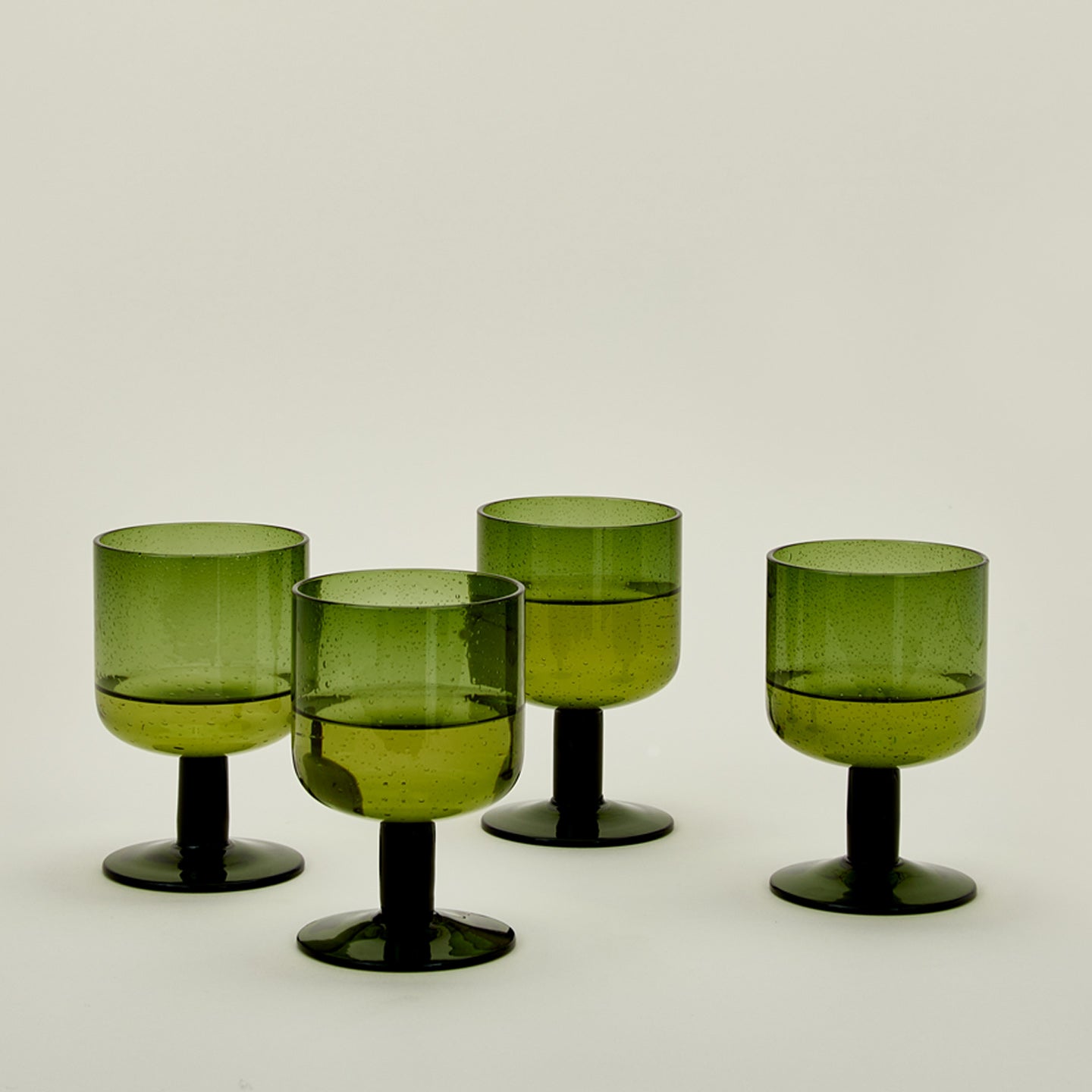 Simple seeded glassware in olive