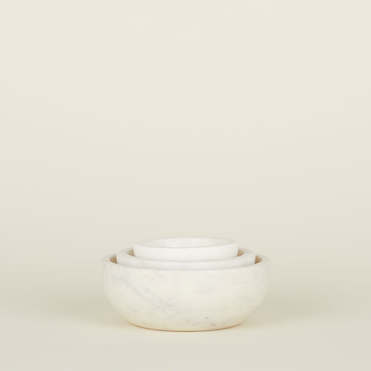 Three Simple Marble Bowls in various sizes in White, nested.