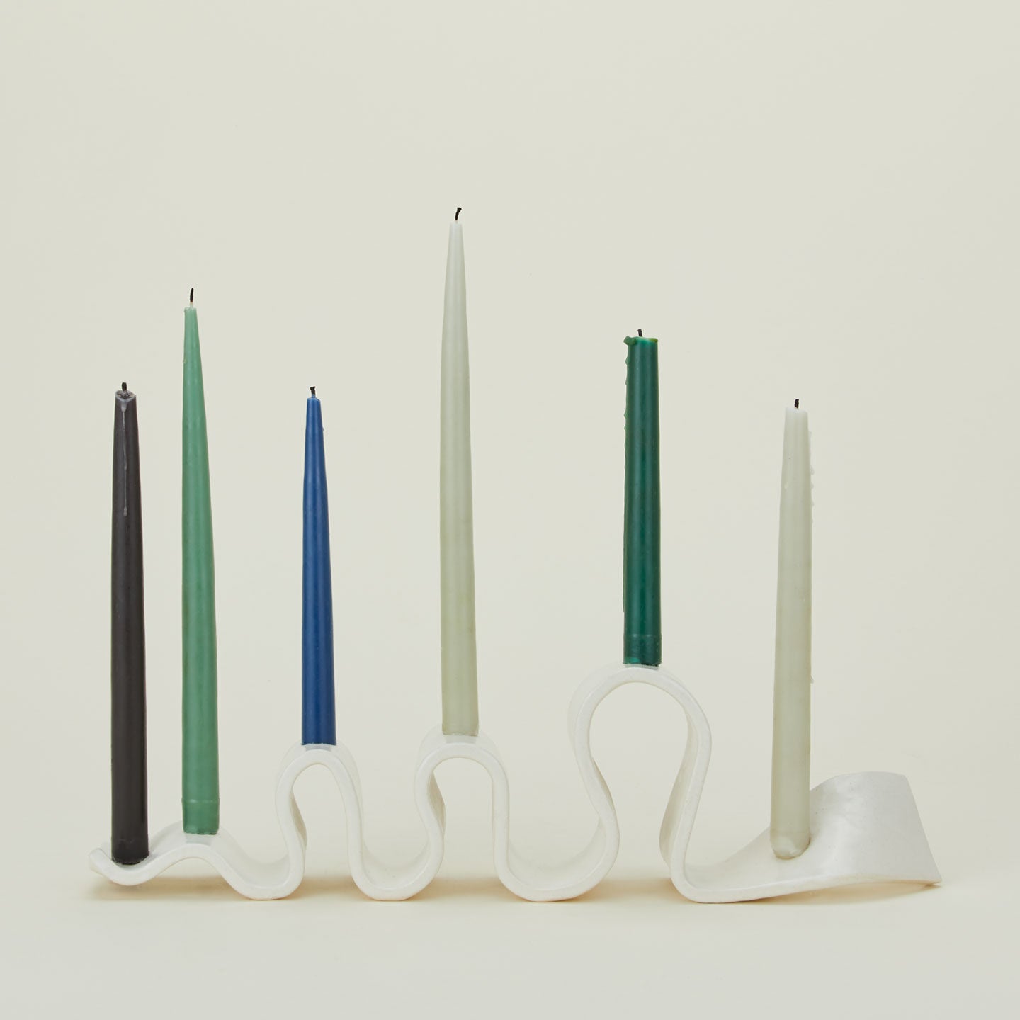 Stoneware Weylyn Candelabra with taper candles.