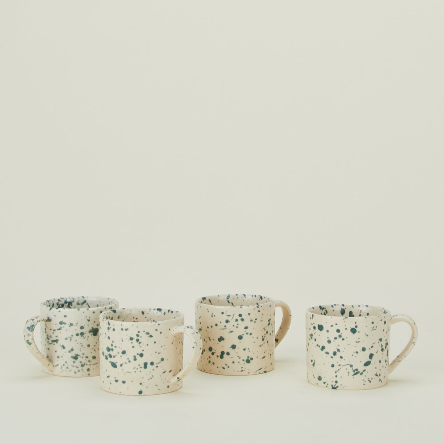 Set of four Splatterware mugs in Pool.