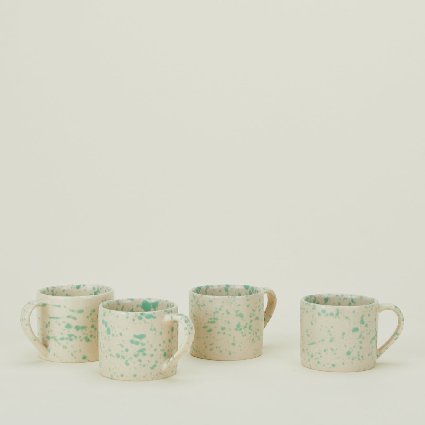 Set of four Splatterware mugs in Nettle.