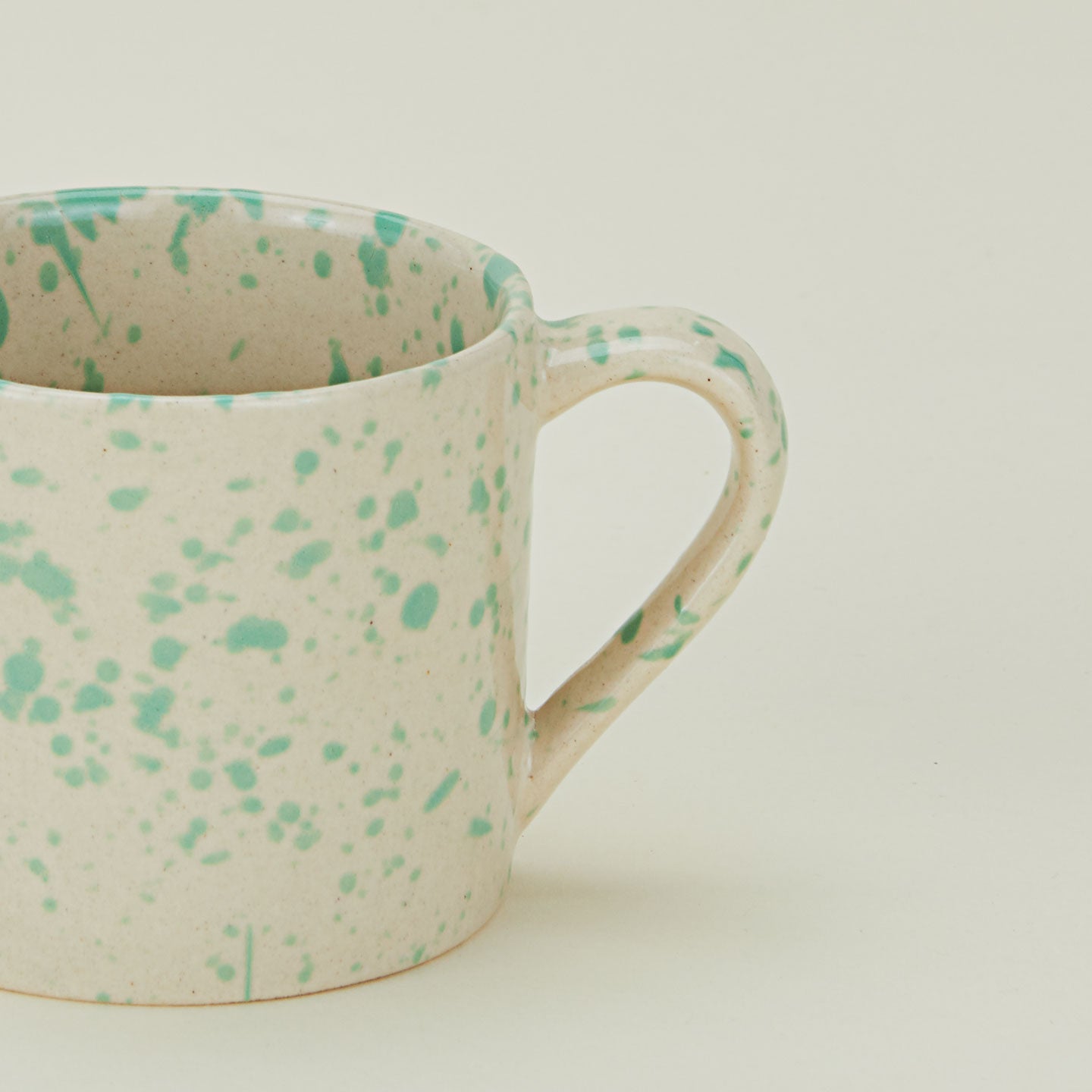 Close up of a Splatterware Mug in Pool.