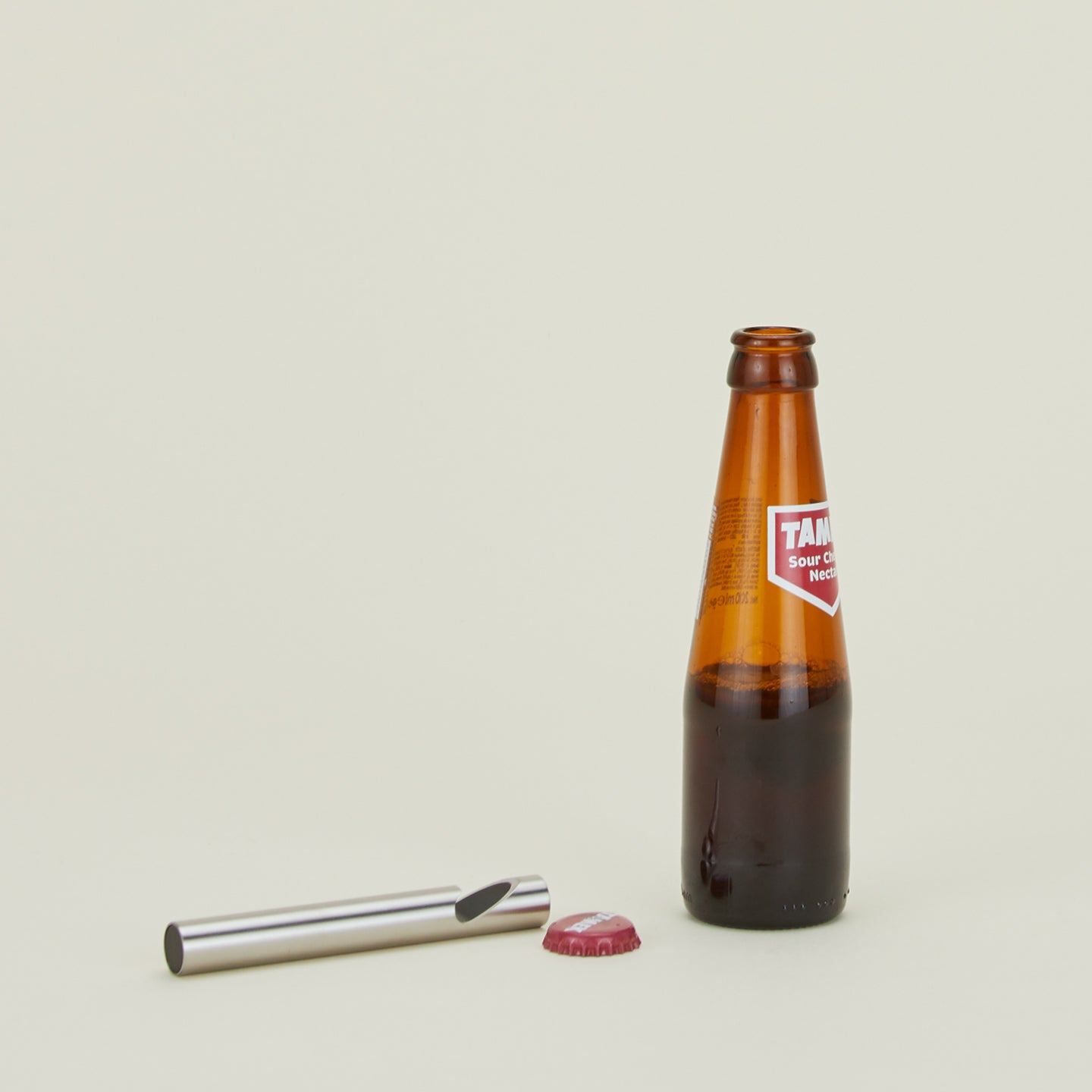 Steel Bottle Opener with bottle of juice.