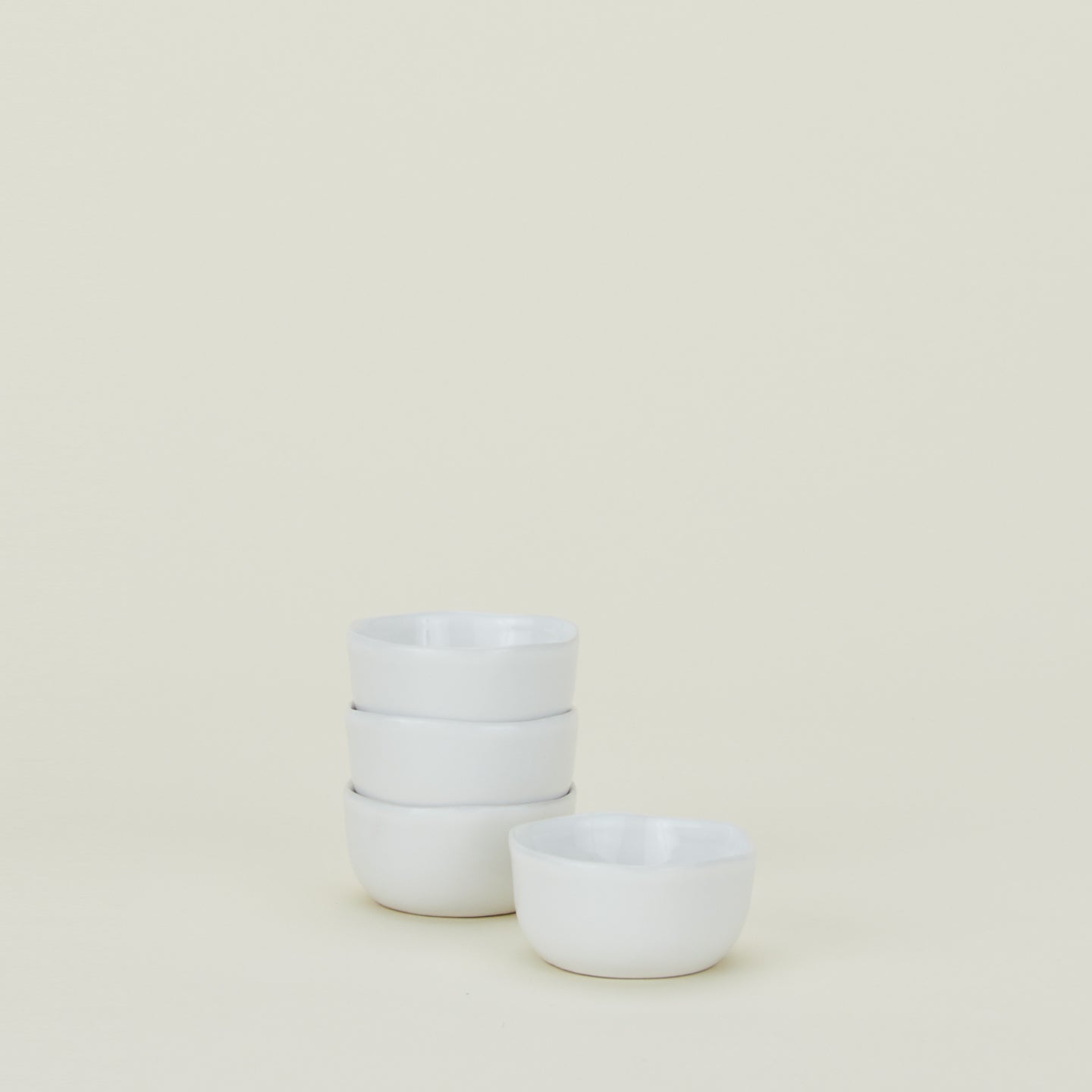 Four white Strata Extra Small Serving Bowls.