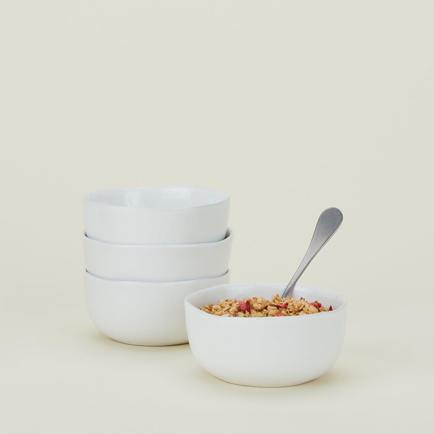 Four white Strata Large Bowls, with cereal.