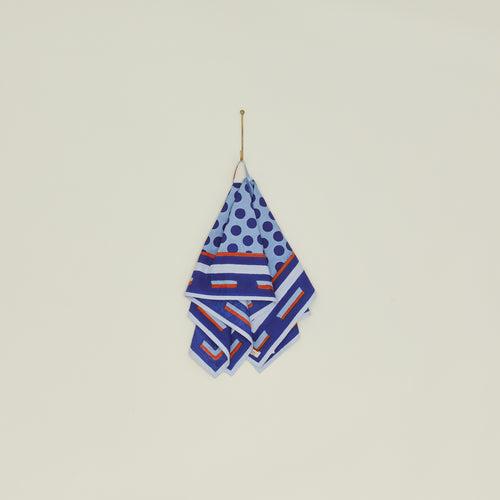 Block Printed Dish Cloth in Blue Dot hanging from hook.
