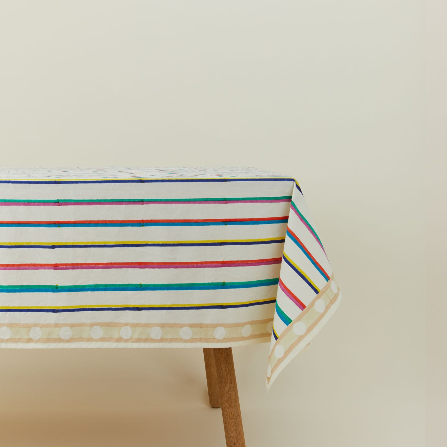 Block Printed Tablecloth in Multi Stripe on table.