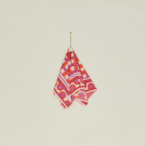 Block Printed Dish Cloth in Red Plaid hanging from hook.