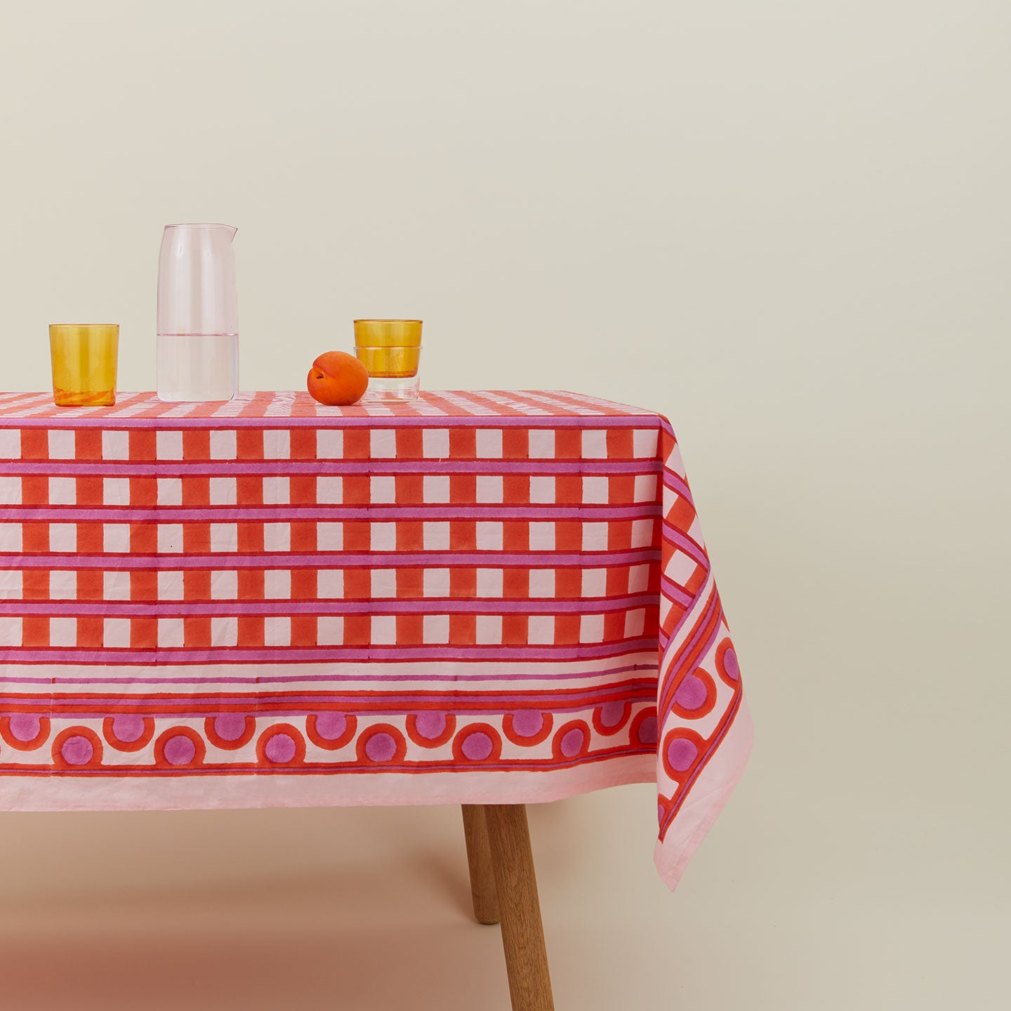 Block Printed Tablecloth in Red Plaid on table.