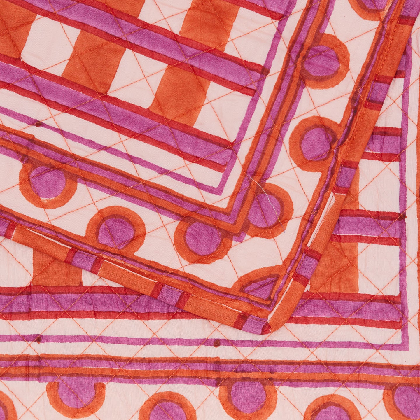 Close up of Block Printed Quilted Placemat in Red Plaid.