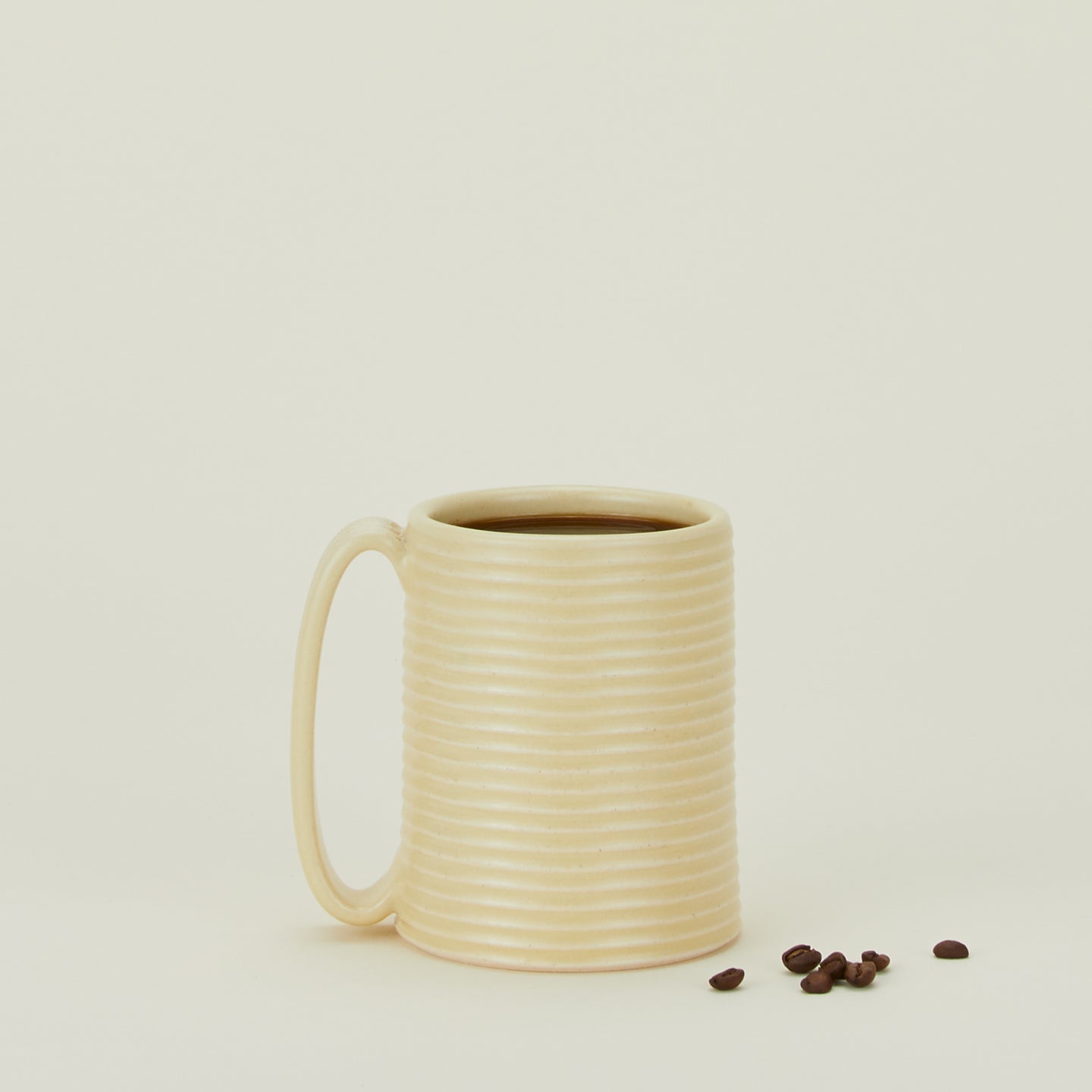 Tall Ribbed Mug in Butter.