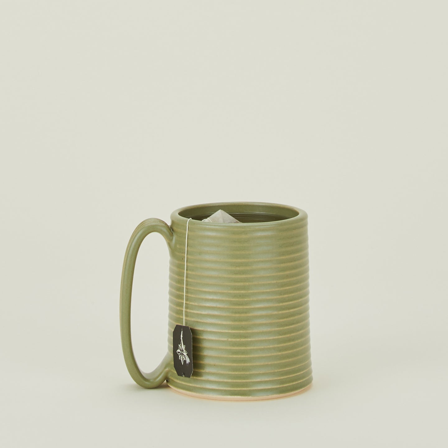 Tall Ribbed Mug in Olive.