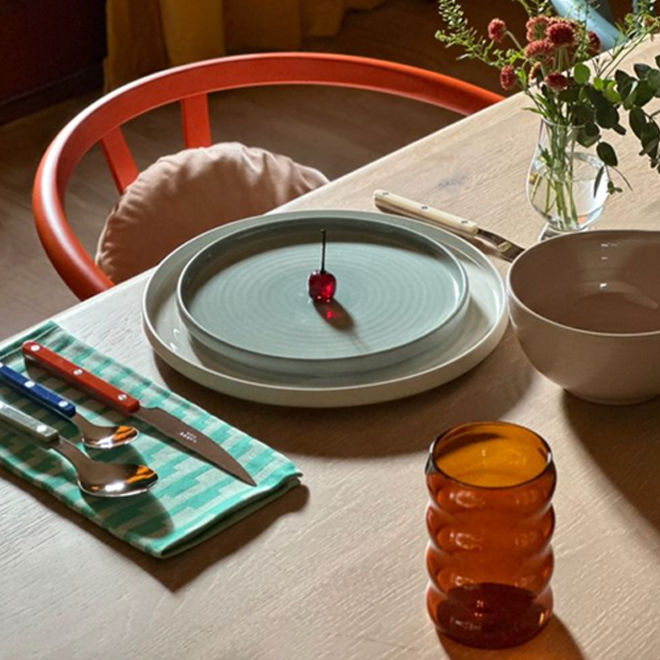 Table setting with plates, flatware, and glasses