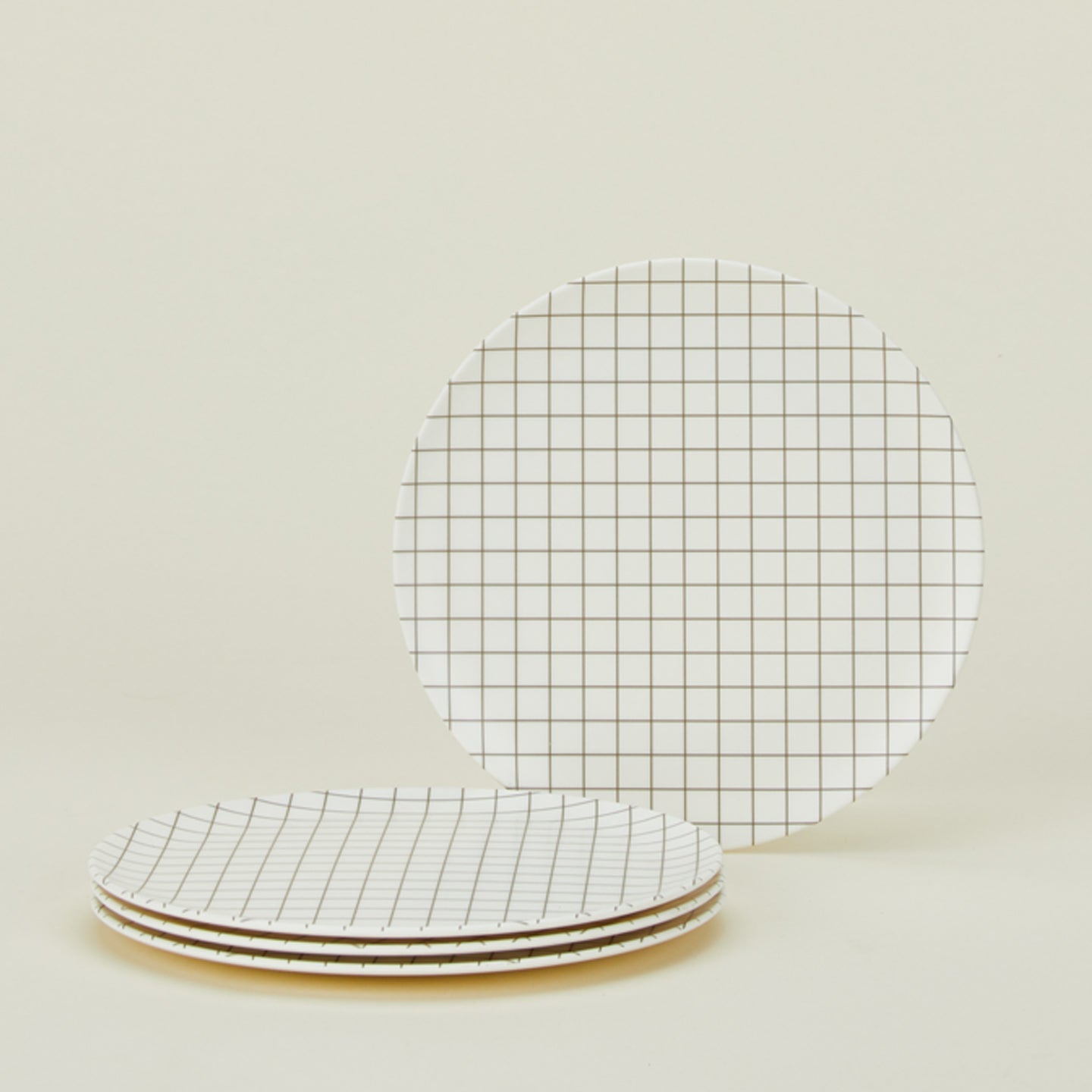 Set of 4 bamboo melamine side plates in Black Grid.