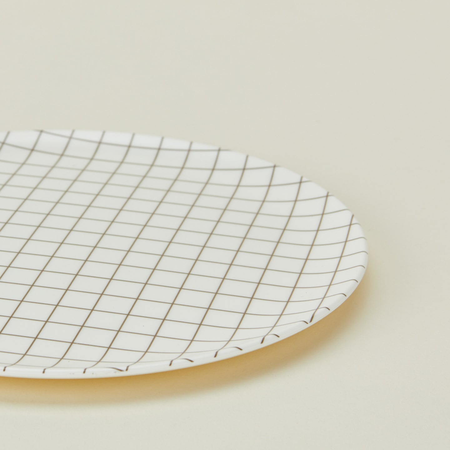 Close up of bamboo melamine dinner plate in Black Grid.