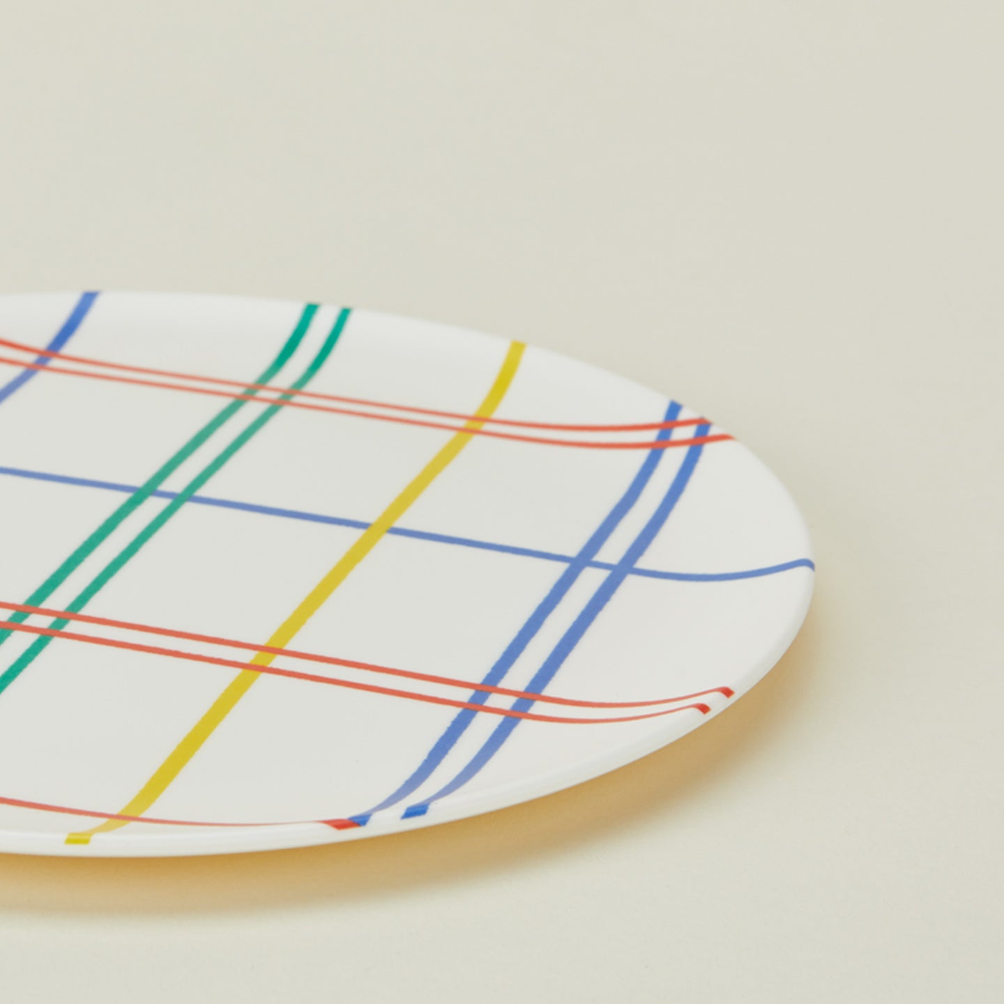 Close up of bamboo melamine side plate in Mixed Plaid.