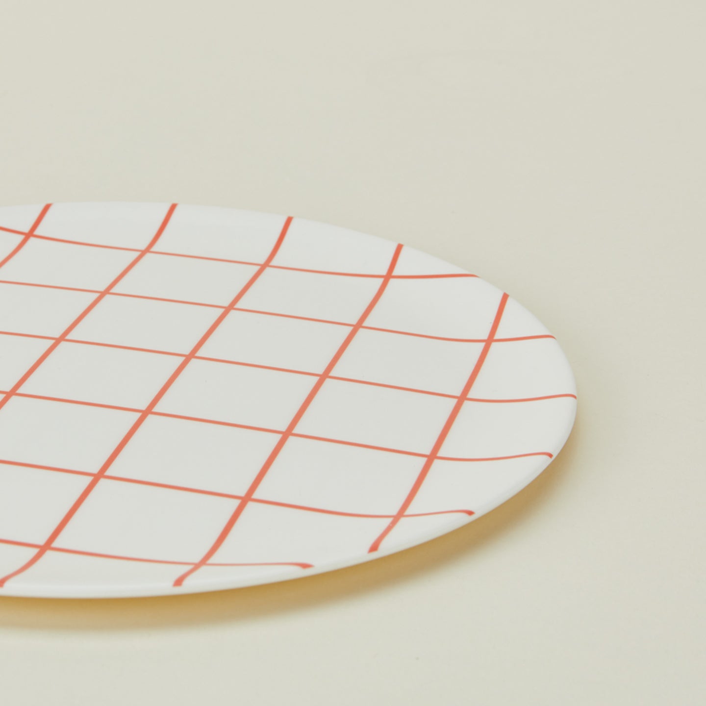 Close up of bamboo melamine dinner plate in Red Grid.