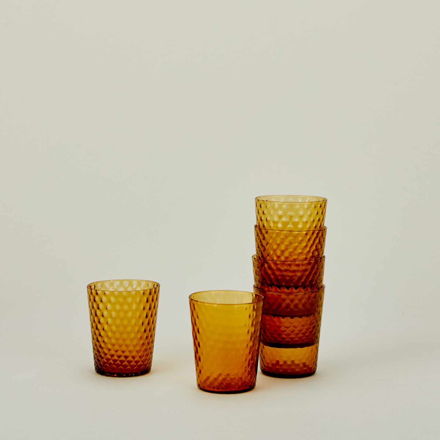 Set of 6 Veneziano Tumblers in Amber, stacked.