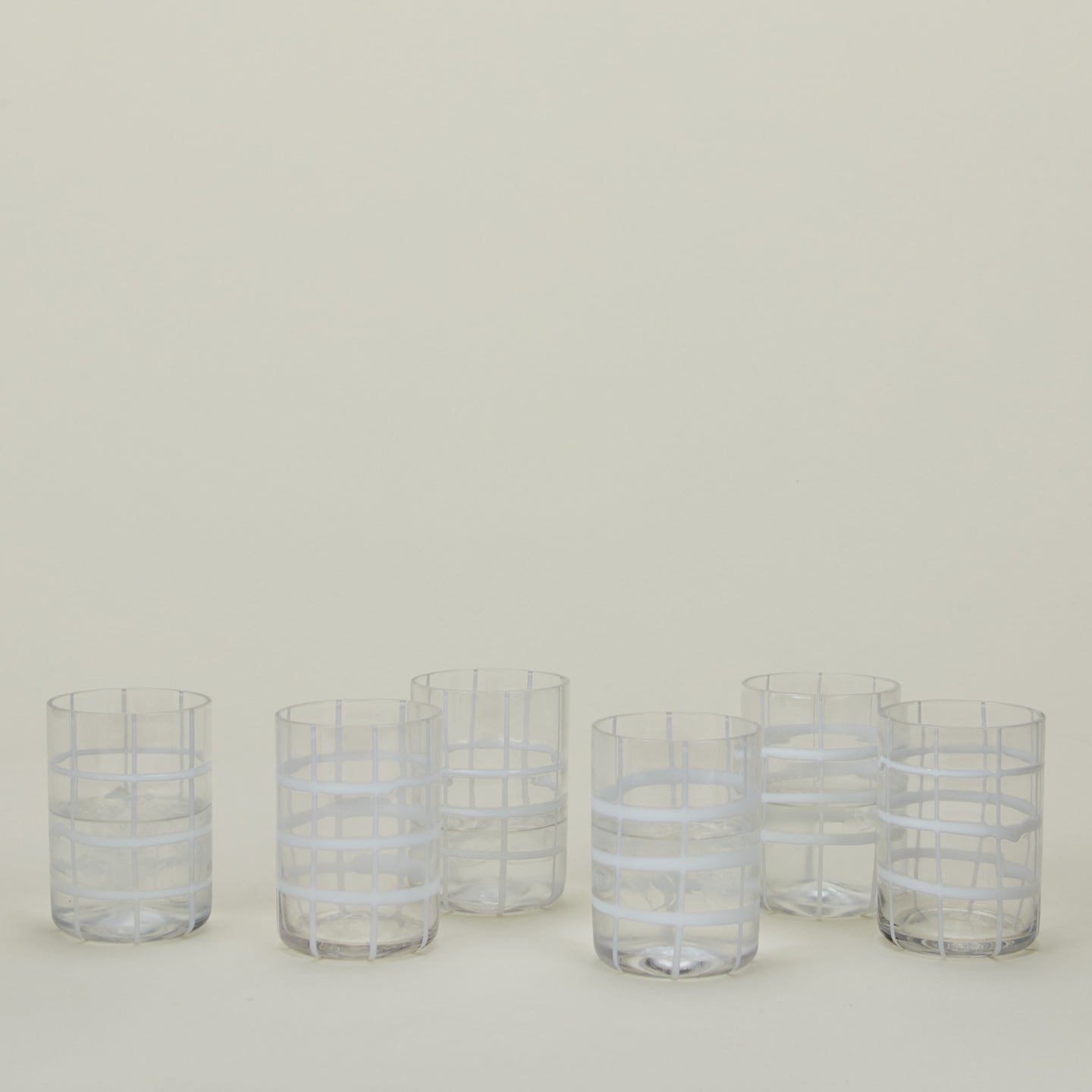 Set of 6 Twiddle Tumblers in Clear with water.