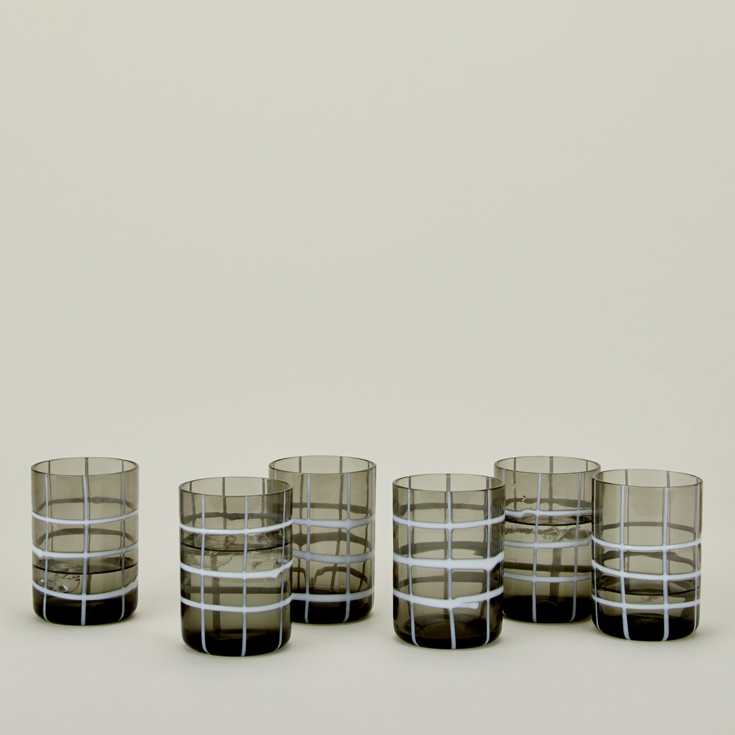 Set of 6 Twiddle Tumblers in Smoke with water.