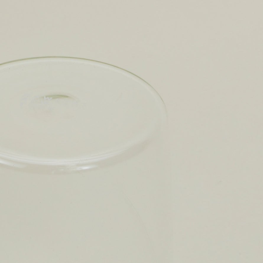 Close up of the bottom of the Essential Glass in Clear.